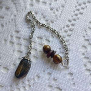 Tiger's Eye and Hawk's Eye Pendulum